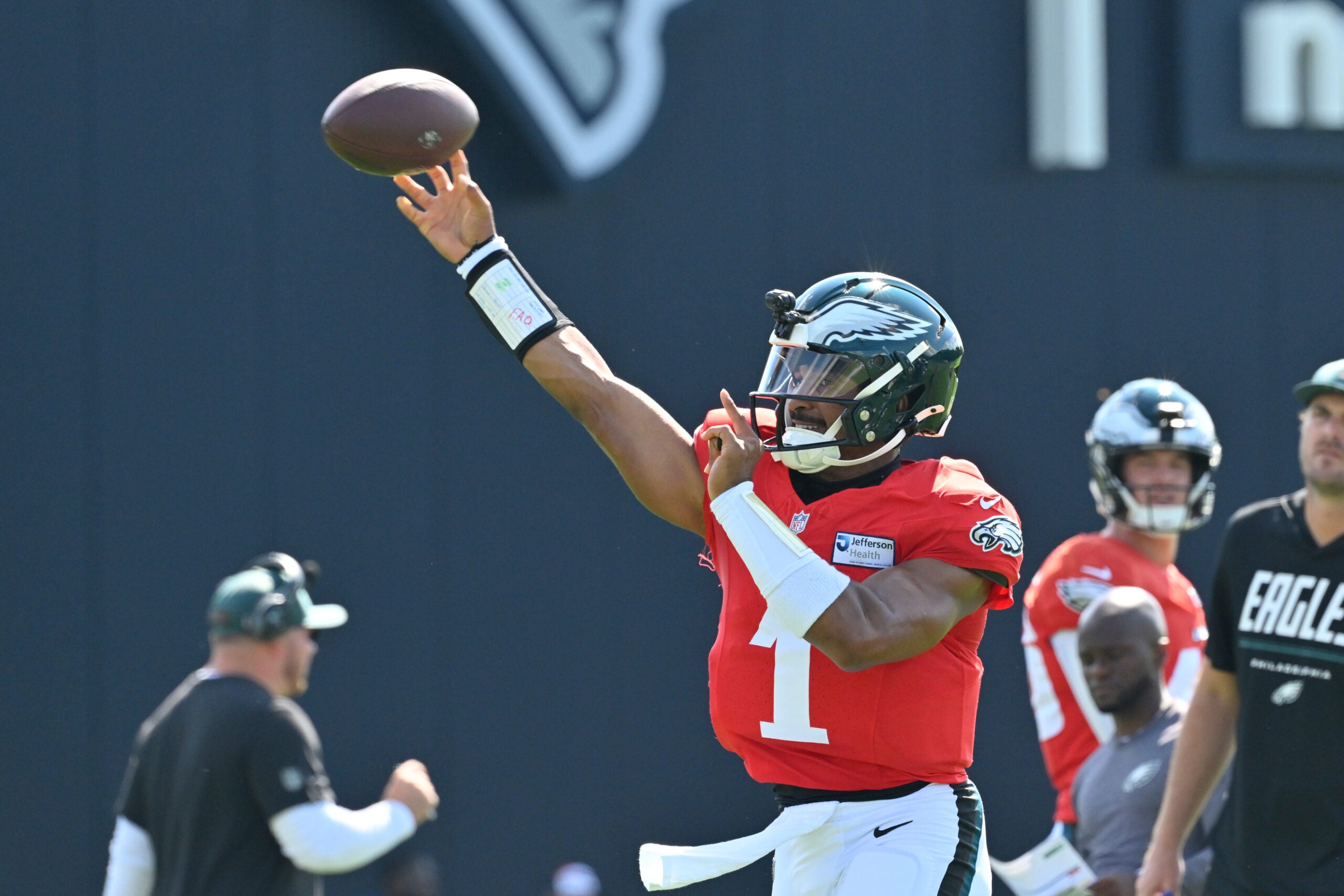 Aug 19, 2026; Foxborough, Massachusetts, USA; Philadelphia Eagles quarterback Jalen Hurts (1) throws a pass during training camp at Gillette Stadium.