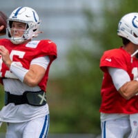 Indianapolis Colts quarterbacks Riley Leonard (15) and Daniel Jones (17) pass Wednesday, Aug. 19, 2026, during a joint practice with the Atlanta Falcons at Grand Park in Westfield.