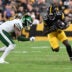 Aug 21, 2026; Pittsburgh, Pennsylvania, USA; Pittsburgh Steelers running back Kaleb Johnson (20) is tackled by New York Jets safety Andre Cisco (8) during the third quarter at Acrisure Stadium.