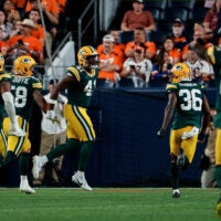 Aug 21, 2026; Denver, Colorado, USA; Green Bay Packers safety Mark Perry (41) reacts with linebacker Isaiah McDuffie (58) and defensive tackle Chris McClellan (55) and cornerback Kamal Hadden (36) after an interception in the second quarter against the Denver Broncos at Empower Field at Mile High.