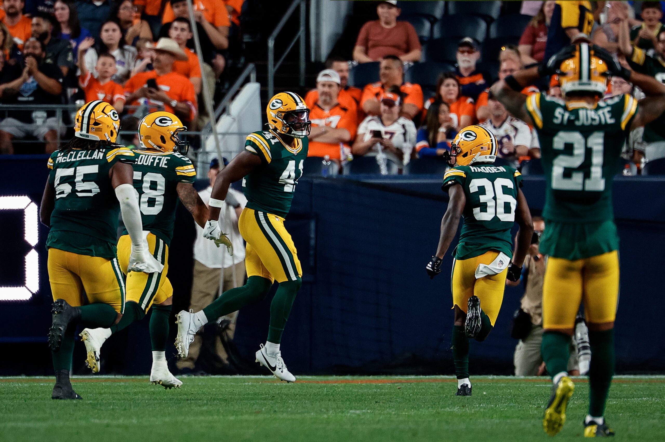 Aug 21, 2026; Denver, Colorado, USA; Green Bay Packers safety Mark Perry (41) reacts with linebacker Isaiah McDuffie (58) and defensive tackle Chris McClellan (55) and cornerback Kamal Hadden (36) after an interception in the second quarter against the Denver Broncos at Empower Field at Mile High.