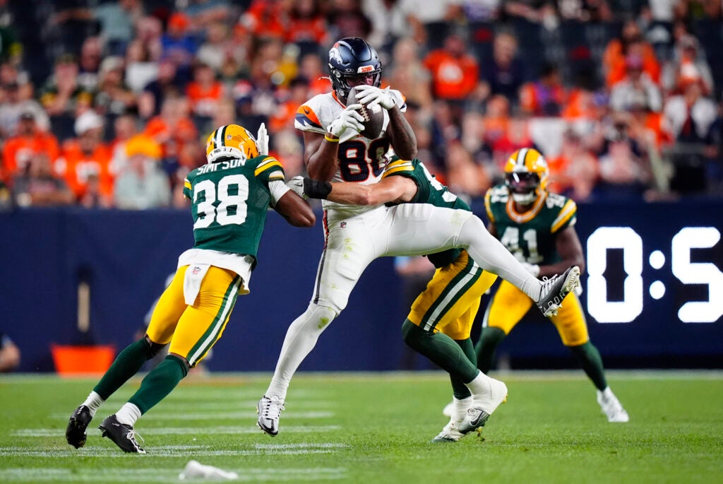 Aug 21, 2026; Denver, Colorado, USA; Denver Broncos tight end Justin Joly (80) pulls in front Green Bay Packers safety Trey Dean (38) in the second half during a preseason game at Empower Field at Mile High.