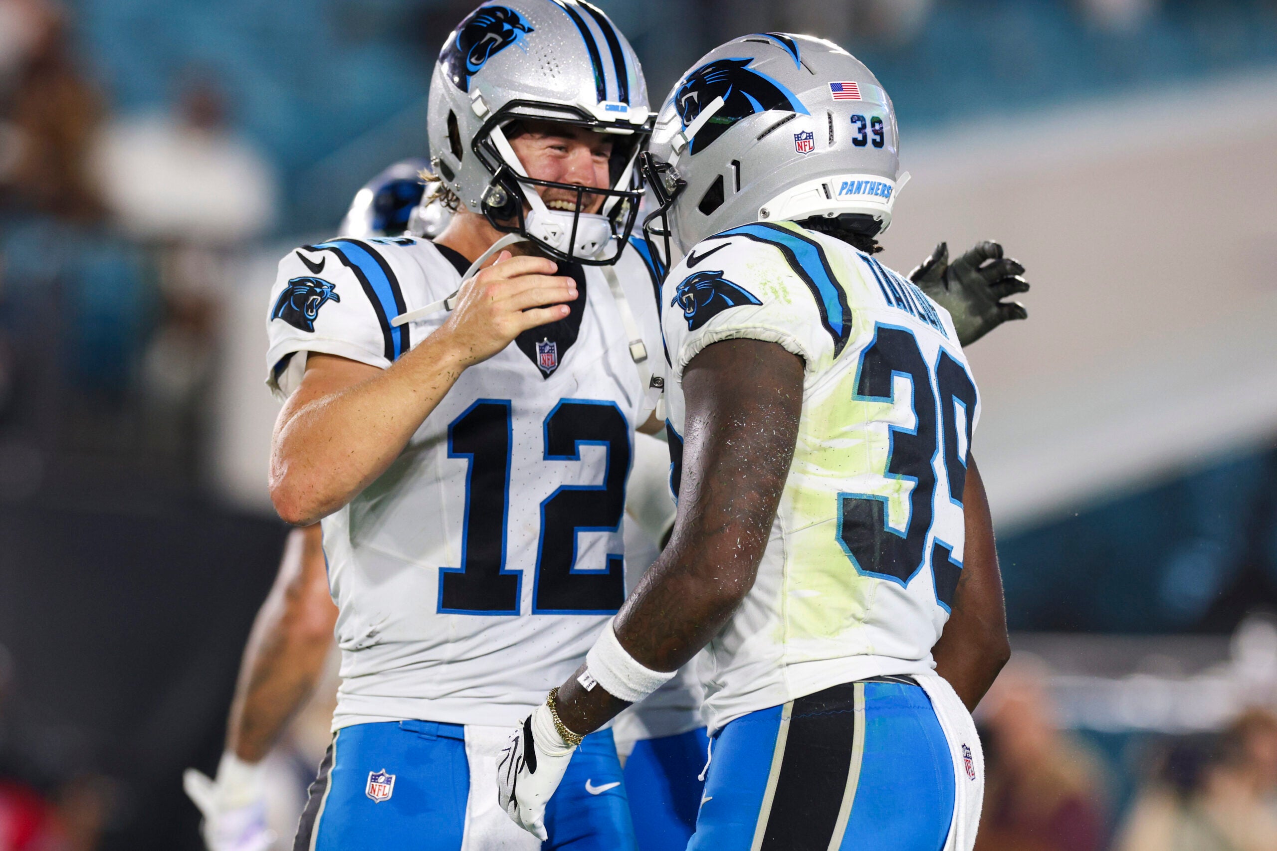 Aug 21, 2026; Jacksonville, Florida, USA; Carolina Panthers quarterback Kenny Pickett (12) congratulates wide receiver Roc Taylor (39) after a touchdown against the Jacksonville Jaguars in the third quarter during a preseason game at EverBank Stadium.