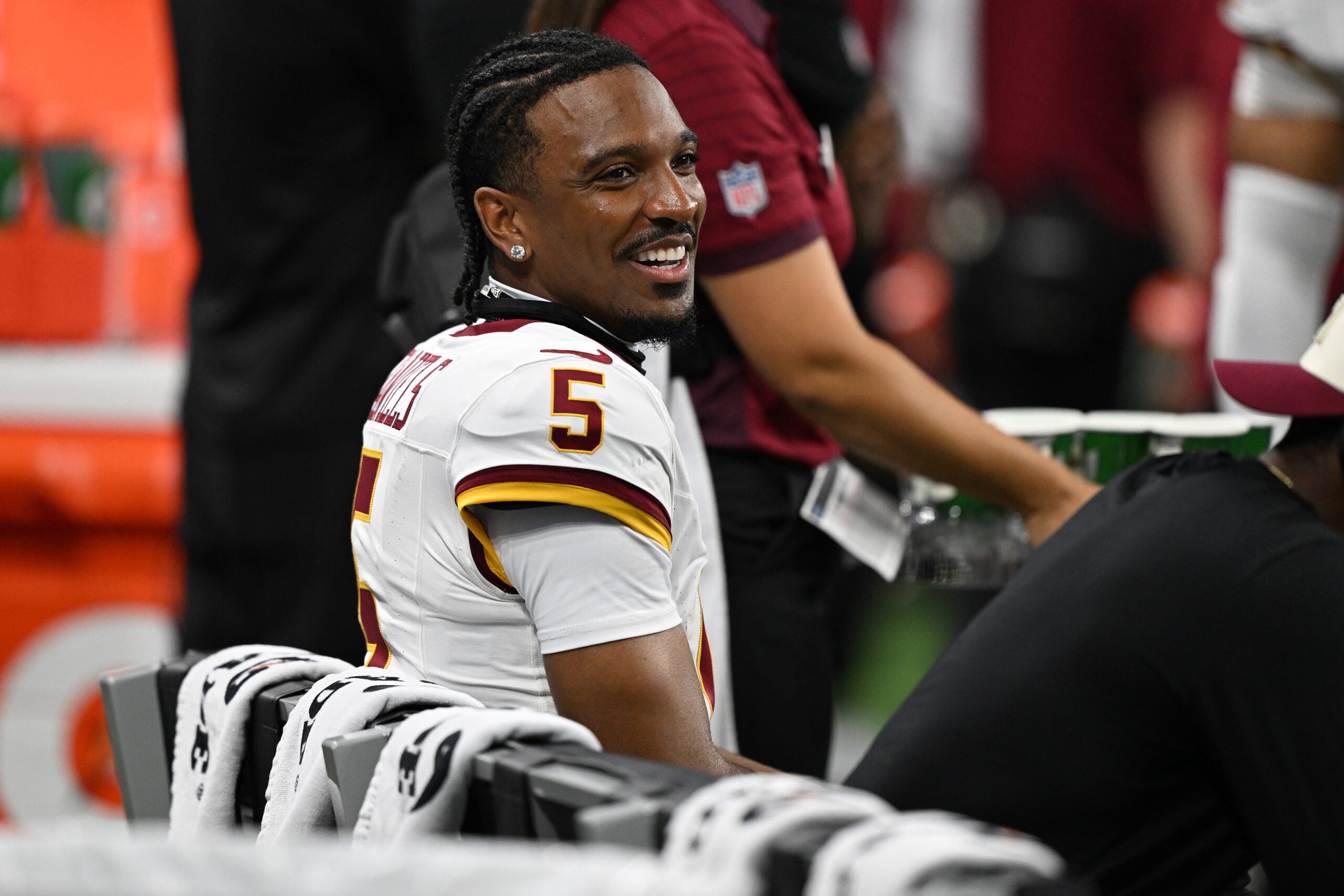 Aug 22, 2026; Detroit, Michigan, USA; Washington Commanders quarterback Jayden Daniels (5) on the bench against the Detroit Lions in the first quarter at Ford Field.