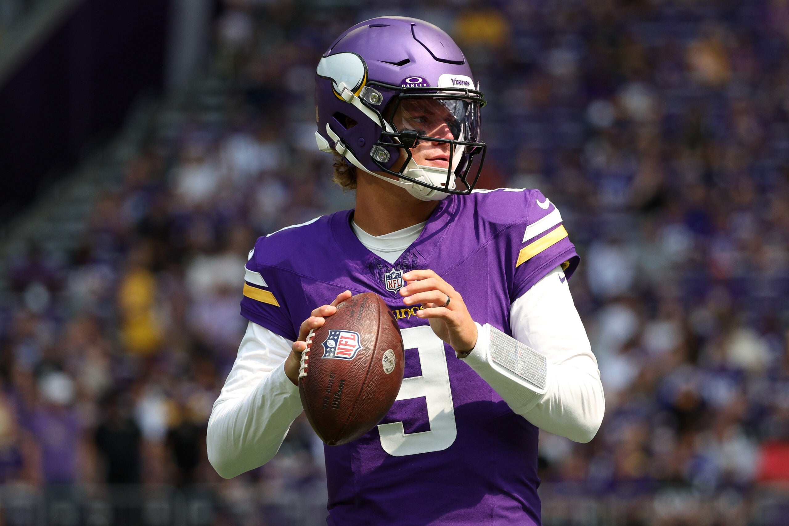 Aug 22, 2026; Minneapolis, Minnesota, USA; Minnesota Vikings quarterback J.J. McCarthy (9) warms up before the game against the Baltimore Ravens at U.S. Bank Stadium.