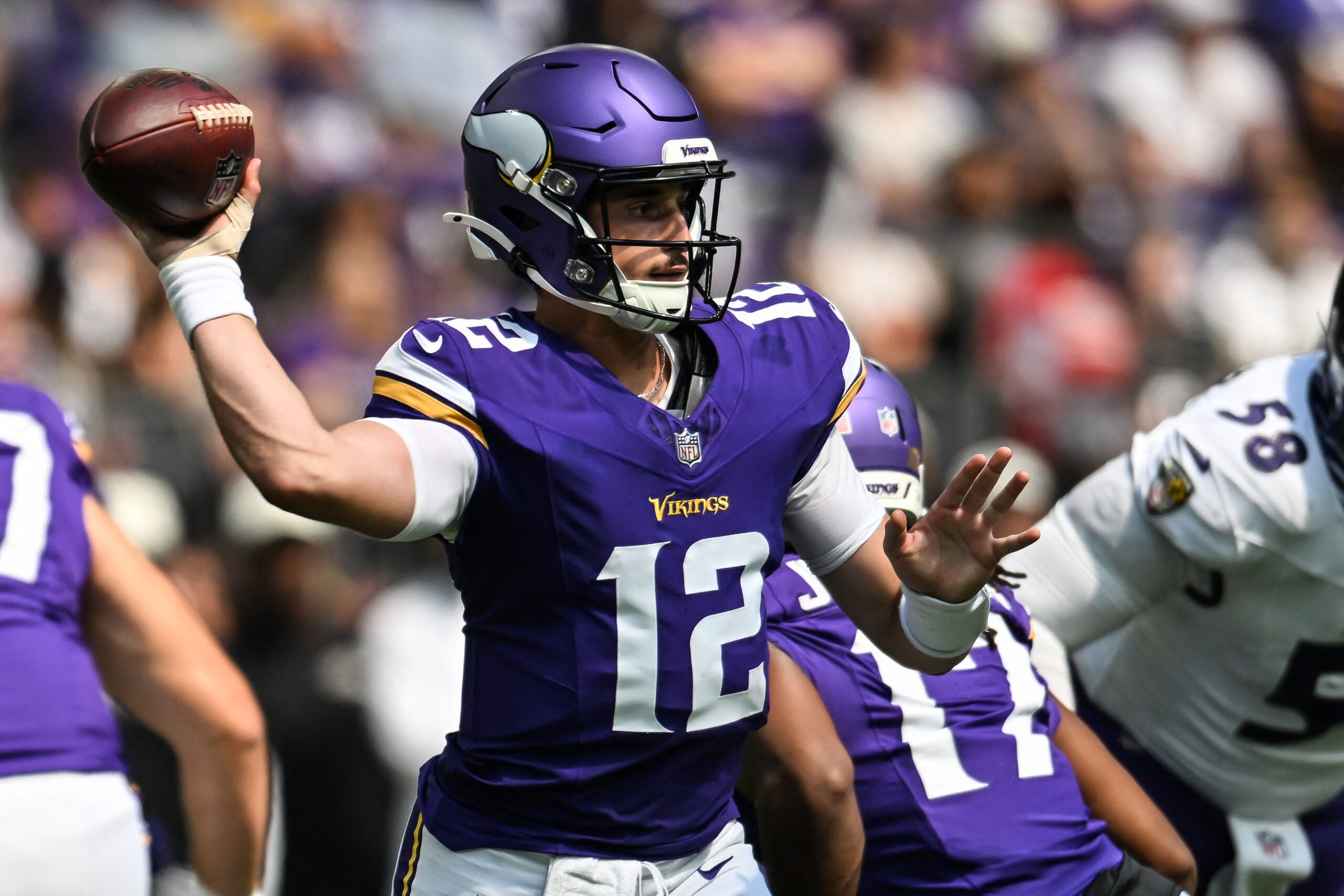 Aug 22, 2026; Minneapolis, Minnesota, USA; Minnesota Vikings quarterback Max Brosmer (12) throws a pass against the Baltimore Ravens during the fourth quarter at U.S. Bank Stadium.
