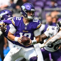 Aug 22, 2026; Minneapolis, Minnesota, USA; Minnesota Vikings quarterback Max Brosmer (12) looks to hand the ball off against the Baltimore Ravens during the third quarter at U.S. Bank Stadium.