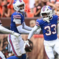 Aug 22, 2026; Cleveland, Ohio, USA; Buffalo Bills cornerback Te'Cory Couch (33) celebrates with cornerback Kani Walker (41) and cornerback Jordan Hancock (37) after making an interception during the second half against the Cleveland Browns at Huntington Bank Field.