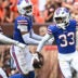 Aug 22, 2026; Cleveland, Ohio, USA; Buffalo Bills cornerback Te'Cory Couch (33) celebrates with cornerback Kani Walker (41) and cornerback Jordan Hancock (37) after making an interception during the second half against the Cleveland Browns at Huntington Bank Field.