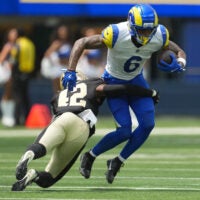Aug 22, 2026; Inglewood, California, USA; Los Angeles Rams wide receiver CJ Daniels (6) carries the ball against 42 in the first half at SoFi Stadium.