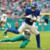 Aug 22, 2026; Miami Gardens, Florida, USA; New York Giants wide receiver Odell Beckham Jr. (3) breaks a tackle against Miami Dolphins cornerback Ethan Bonner (27) during the first half at Hard Rock Stadium.