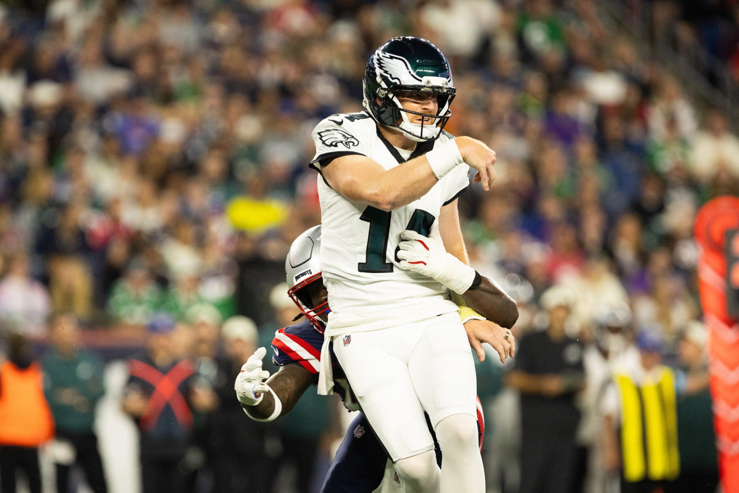 Aug 22, 2026; Foxborough, Massachusetts, USA; New England Patriots linebacker Gabe Jacas (50) tackles Philadelphia Eagles quarterback Andy Dalton (14) in the first half at Gillette Stadium.