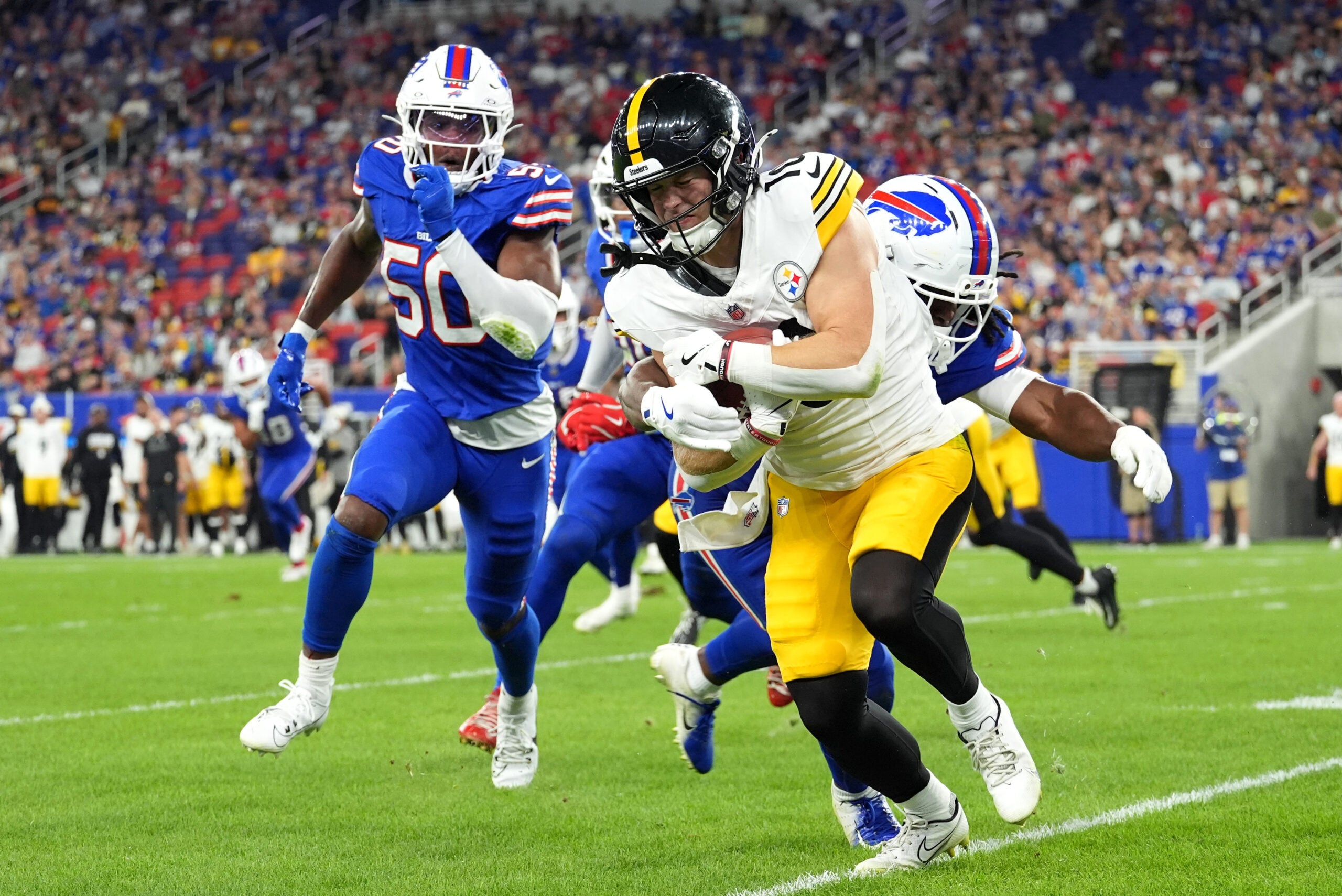 Aug 27, 2026; Orchard Park, New York, USA; Buffalo Bills linebacker Keonta Jenkins (49) tackles Pittsburgh Steelers wide receiver Kaden Wetjen (10) during the second half at New Highmark Stadium.
