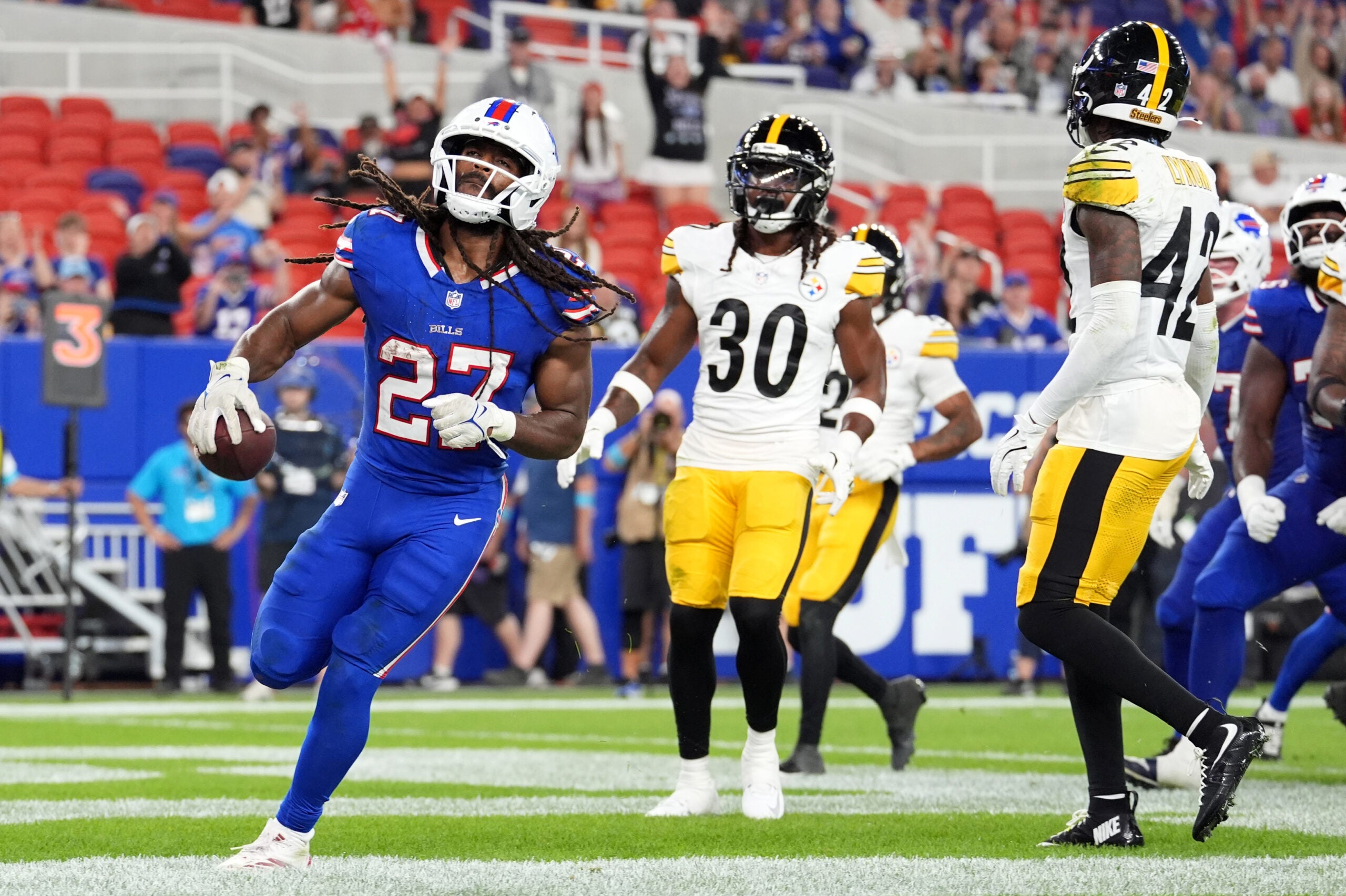 Aug 27, 2026; Orchard Park, New York, USA; Buffalo Bills running back Ian Wheeler (27) scores a touchdown against the Pittsburgh Steelers during the fourth quarter at New Highmark Stadium.