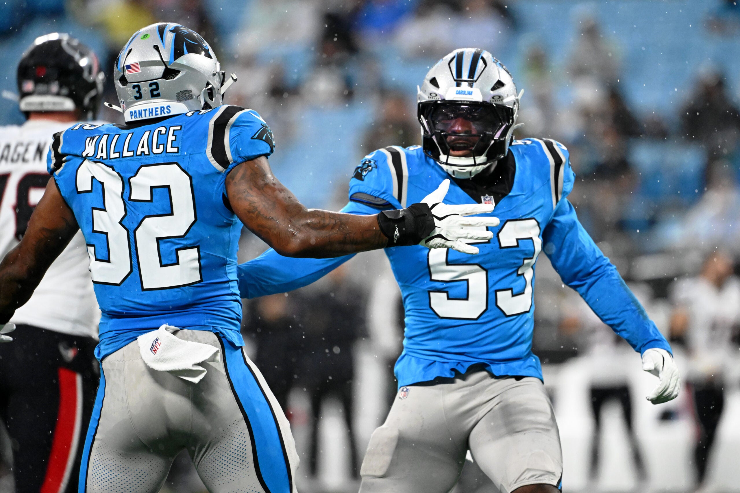 Aug 28, 2026; Charlotte, North Carolina, USA; Carolina Panthers linebacker Claudin Cherelus (53) celebrates with linebacker Trevin Wallace (32) after a play against the Houston Texans during the first half at Bank of America Stadium.