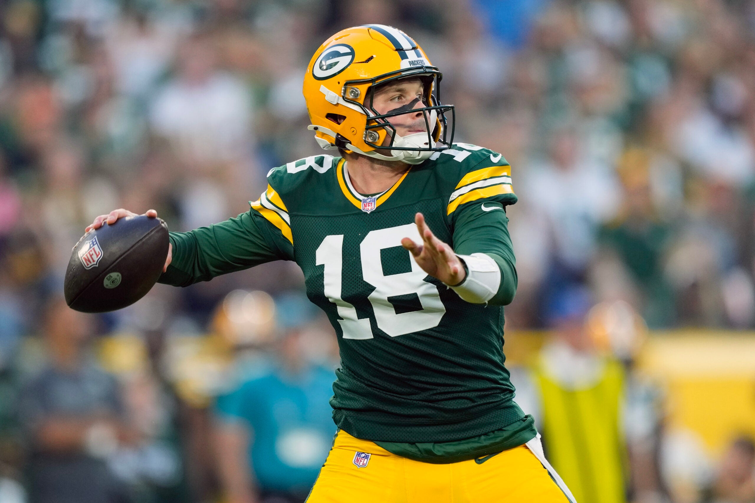 Aug 28, 2026; Green Bay, Wisconsin, USA; Green Bay Packers quarterback Kyle McCord (18) throws a pass during the first quarter against the Arizona Cardinals at Lambeau Field.