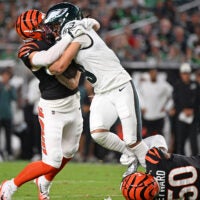 Aug 28, 2026; Philadelphia, Pennsylvania, USA; Cincinnati Bengals linebacker Swayze Bozeman (47) and linebacker Shaka Heyward (50) tackle Philadelphia Eagles wide receiver Makai Lemon (9) during the first half at Lincoln Financial Field.