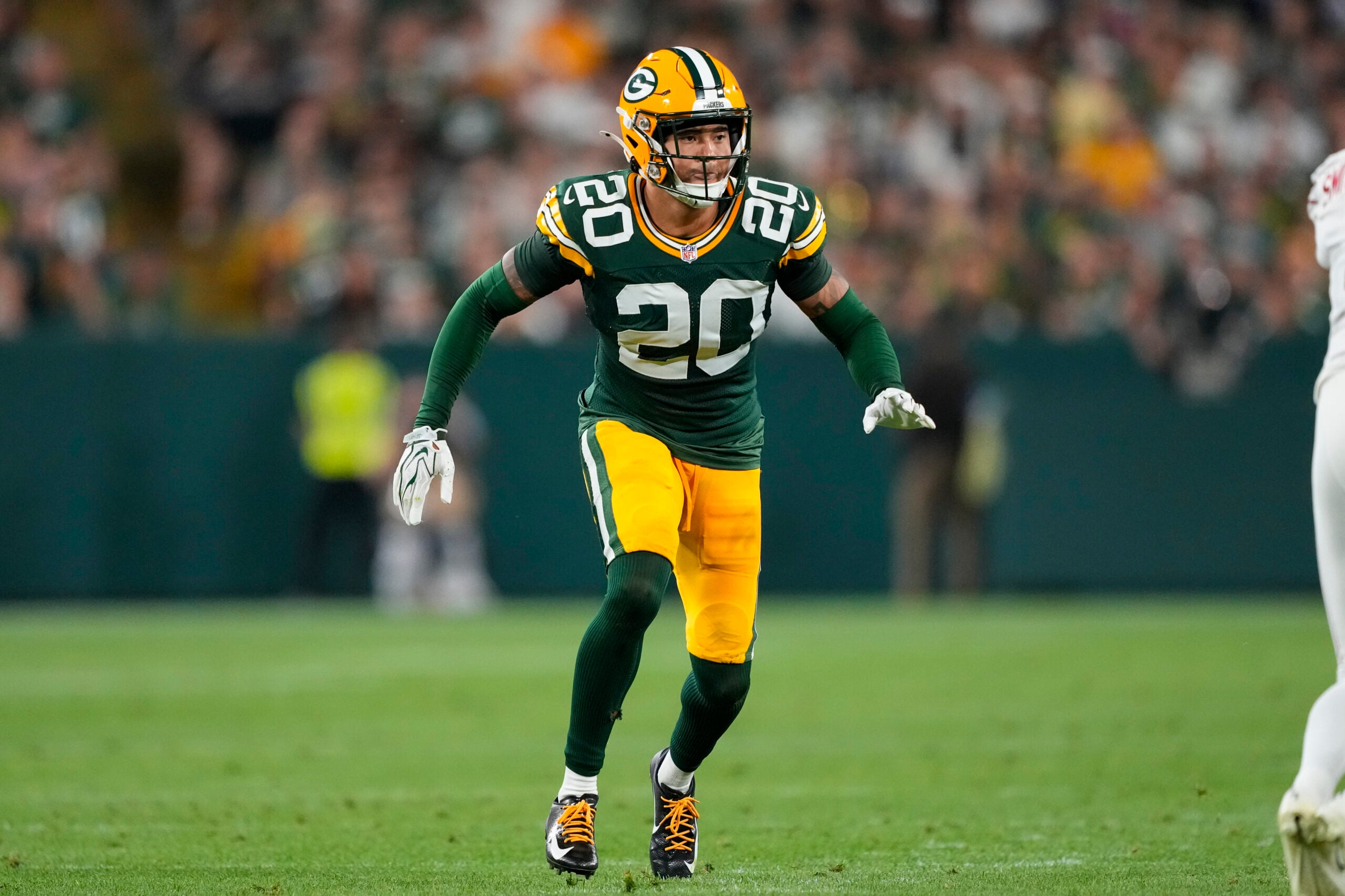Aug 28, 2026; Green Bay, Wisconsin, USA; Green Bay Packers cornerback Domani Jackson (20) defends during the second quarter against the Arizona Cardinals at Lambeau Field.