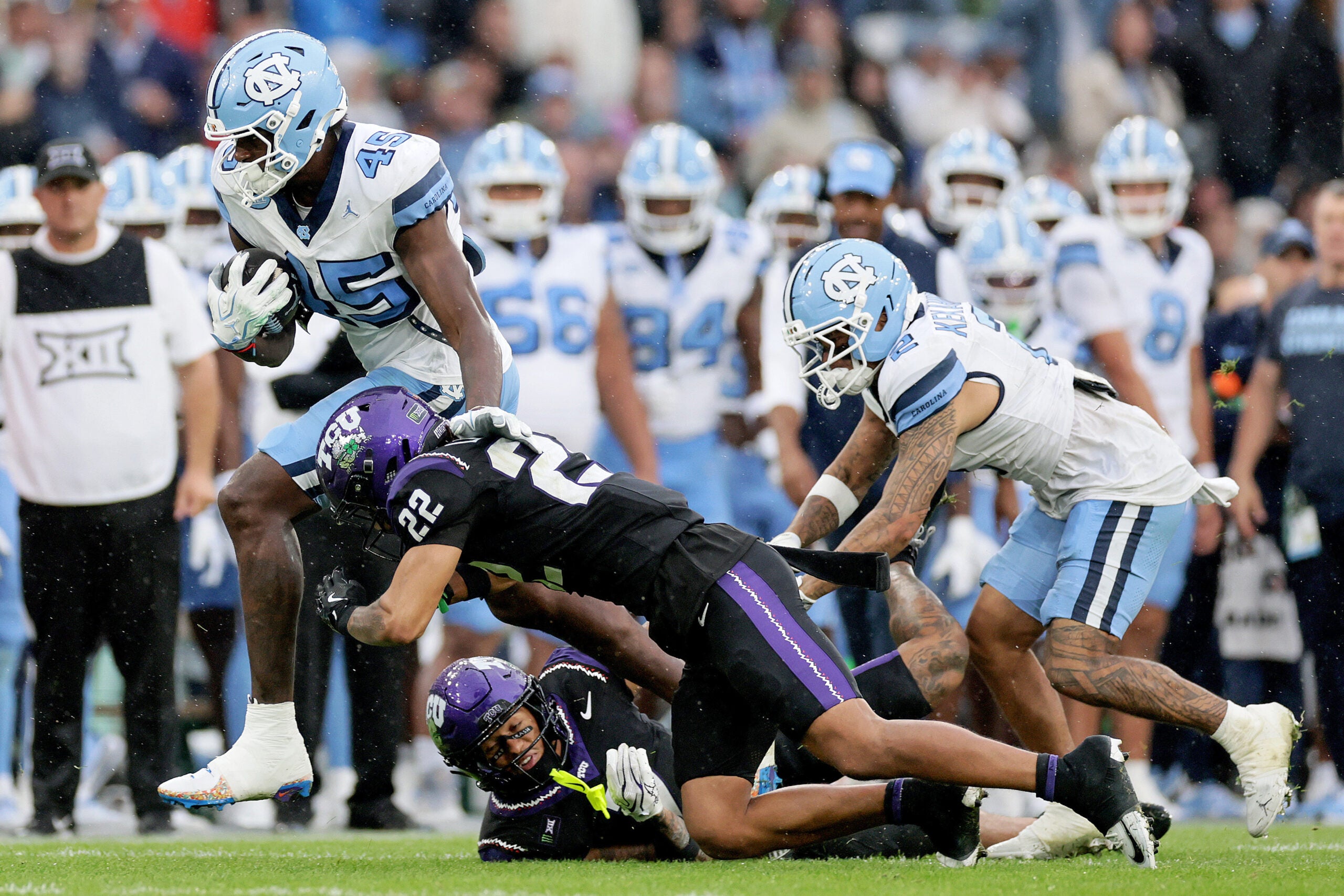 Aug 29, 2026; Dublin, Co. Dublin, IRL; North Carolina Tar Heels tight end Jelani Thurman (45) is tackled by TCU Horned Frogs safety Jordan Lester (22) in the second half at Aviva Stadium.