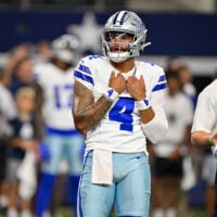 Aug 28, 2026; Arlington, Texas, USA; Dallas Cowboys quarterback Dak Prescott (4) looks on before the game between the Cowboys and the Saints at AT&T Stadium.