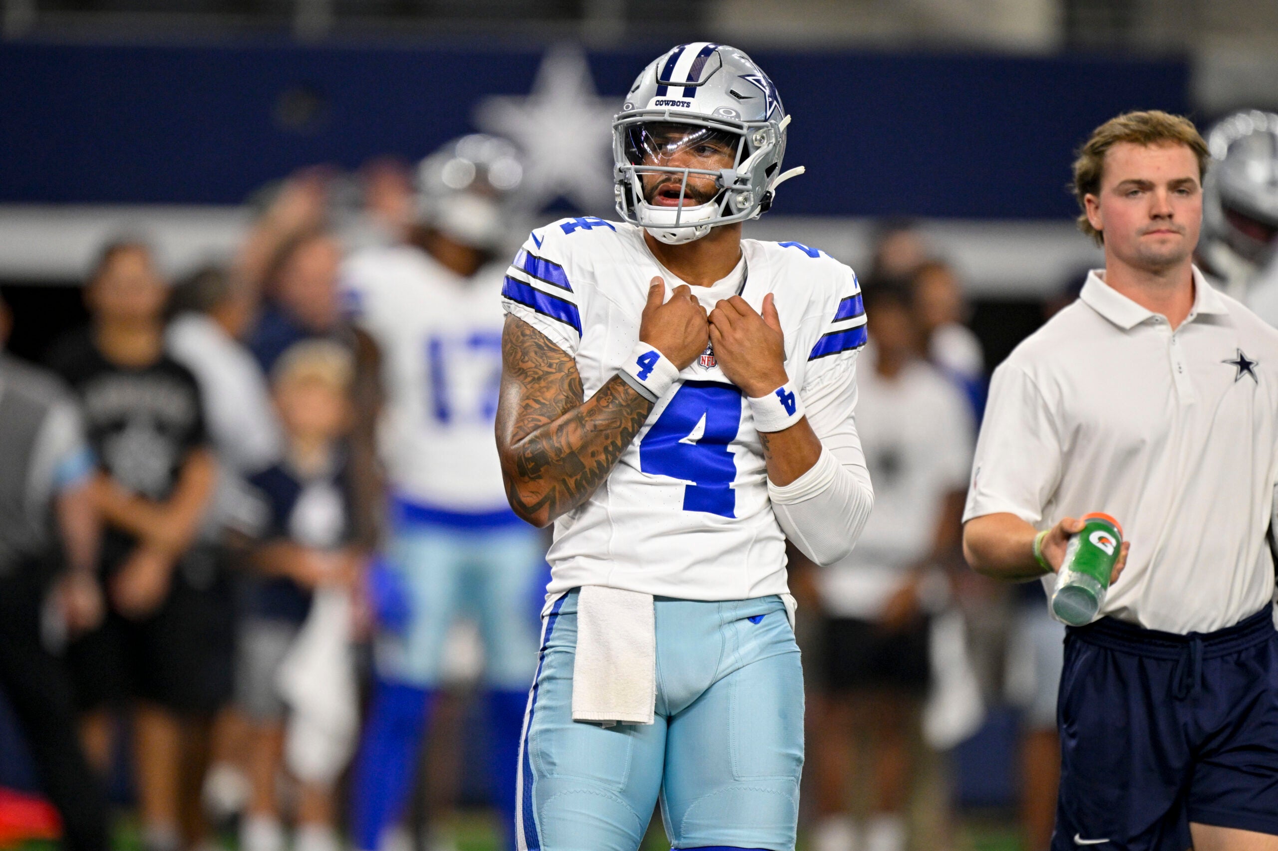 Aug 28, 2026; Arlington, Texas, USA; Dallas Cowboys quarterback Dak Prescott (4) looks on before the game between the Cowboys and the Saints at AT&T Stadium.