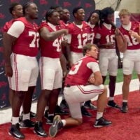 Alabama players swarm Crimson Tide quarterback Keelon Russell to ask for his autograph, 8/8/2026.