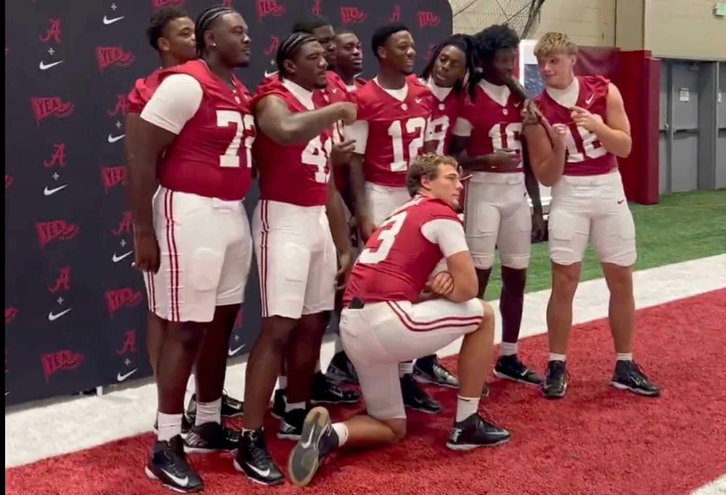 Alabama players swarm Crimson Tide quarterback Keelon Russell to ask for his autograph, 8/8/2026.