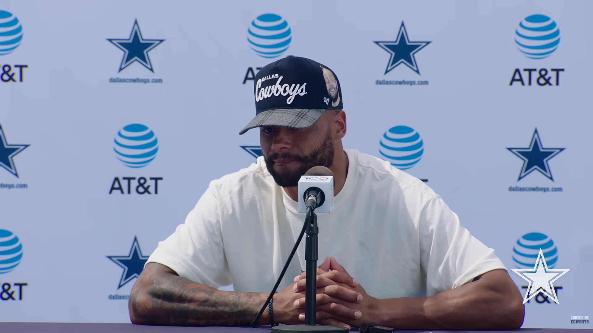 Dallas Cowboys quarterback Dak Prescott wears a hat with a portrait of his brother, Jace, during a training camp press conference.