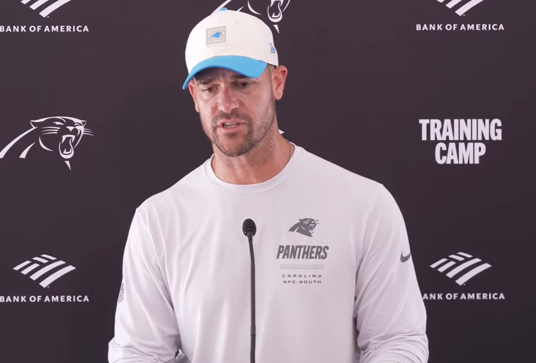 Carolina Panthers head coach Dave Canales talks with reporters following Monday's training camp practice.