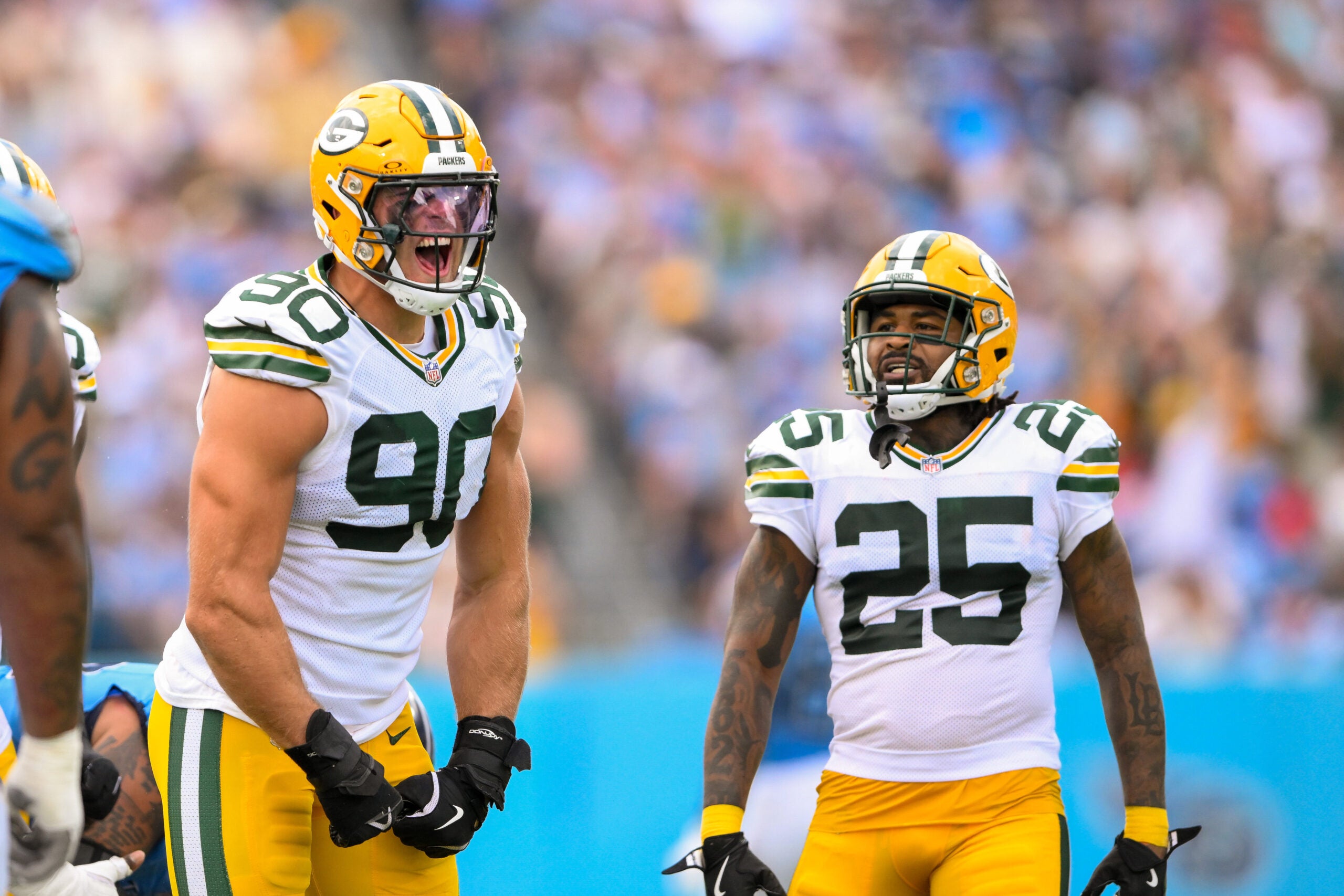 Sep 22, 2024; Nashville, Tennessee, USA; Green Bay Packers defensive end Lukas Van Ness (90) and cornerback Keisean Nixon (25) celebrate the sack if Tennessee Titans Will Levis (8) during the first half at Nissan Stadium.