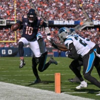 Oct 6, 2024; Chicago, Illinois, USA; Chicago Bears quarterback Caleb Williams (18) runs the ball against the Carolina Panthers during the third quarter at Soldier Field.