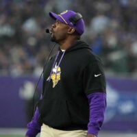 Oct 6, 2024; London, United Kingdom; Minnesota Vikings defensive coordinator Brian Flores watches from the sidelines against the New York Jets in the second half at Tottenham Hotspur Stadium.