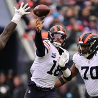 Nov 24, 2024; Chicago, Illinois, USA; Chicago Bears quarterback Caleb Williams (18) passes the ball against the Minnesota Vikings during the third quarter at Soldier Field.