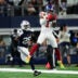 Nov 28, 2024; Arlington, Texas, USA; New York Giants wide receiver Malik Nabers (1) catches a pass as Dallas Cowboys safety Malik Hooker (28) gives chase during the first half at AT&T Stadium.