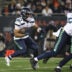 Dec 26, 2024; Chicago, Illinois, USA; Seattle Seahawks running back Kenny McIntosh (25) runs for a gain during the first quarter against the Chicago Bears at Soldier Field.