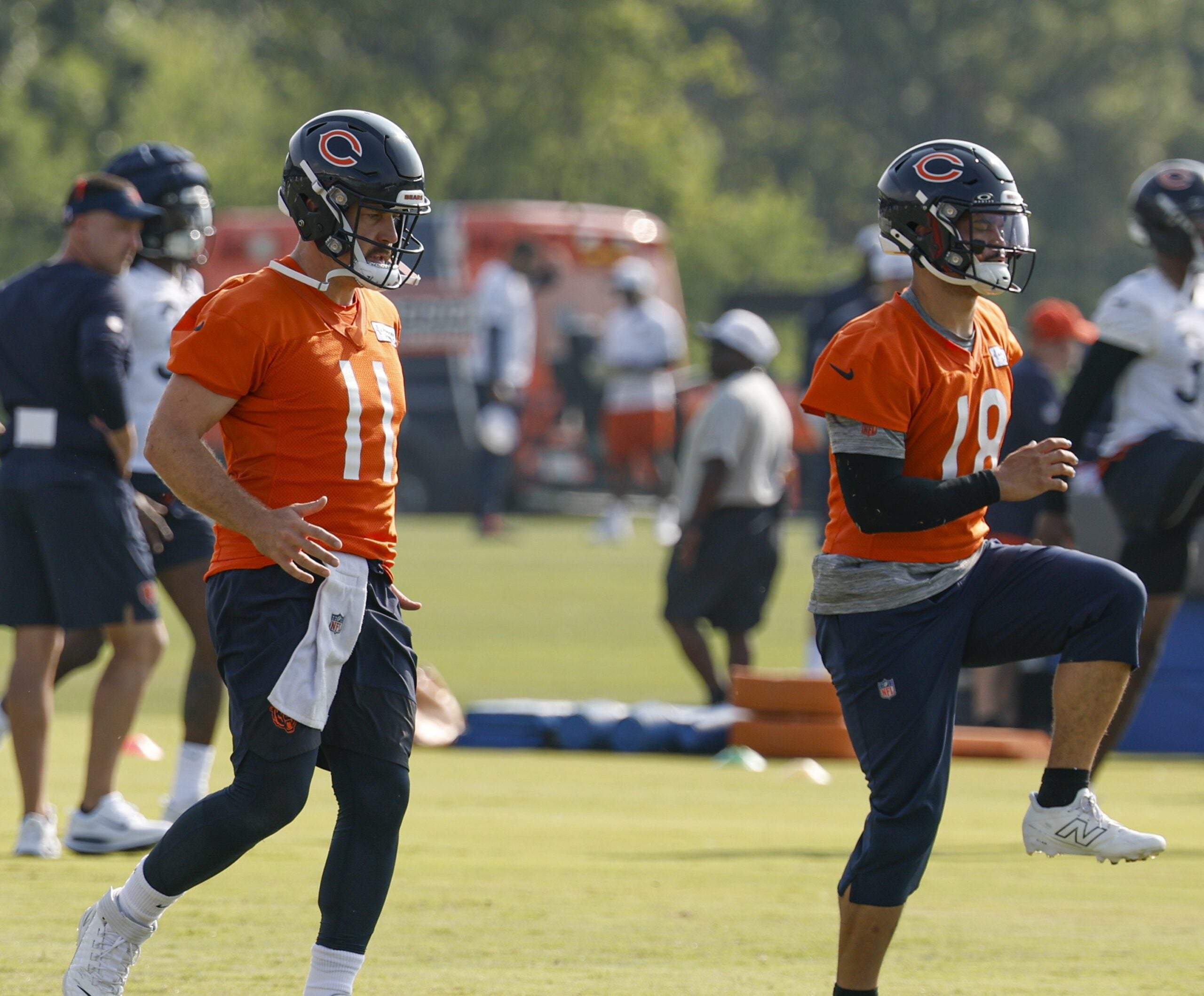 Jul 23, 2025; Lake Forest, IL, USA; Chicago Bears quarterbacks Case Keenum (11) and Caleb Williams (18) warm up during training camp at Halas Hall.