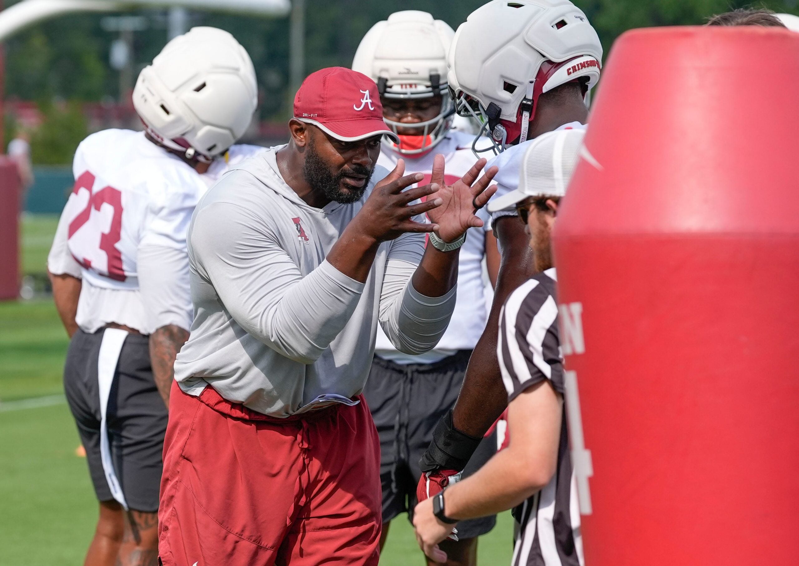 July 30, 2025; Tuscaloosa, AL, USA; Defensive line coach Freddie Roach works with players during the first practice session of the preseason for the Alabama Crimson Tide.