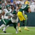 Aug 9, 2025; Green Bay, Wisconsin, USA; New York Jets defensive tackle Jay Tufele (78) sacks Green Bay Packers quarterback Jordan Love (10) during the game at Lambeau Field.