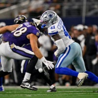 Aug 16, 2025; Arlington, Texas, USA; Baltimore Ravens tight end Charlie Kolar (88) and Dallas Cowboys defensive end Donovan Ezeiruaku (41) in action during the game between the Dallas Cowboys and the Baltimore Ravens at AT&T Stadium.