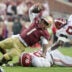 Aug 30, 2025; Tallahassee, Florida, USA; Florida State Seminoles quarterback Tommy Castellanos (1) loses his footing against Alabama Crimson Tide linebacker Jah-Marien Latham (20) during the second half at Doak S. Campbell Stadium.