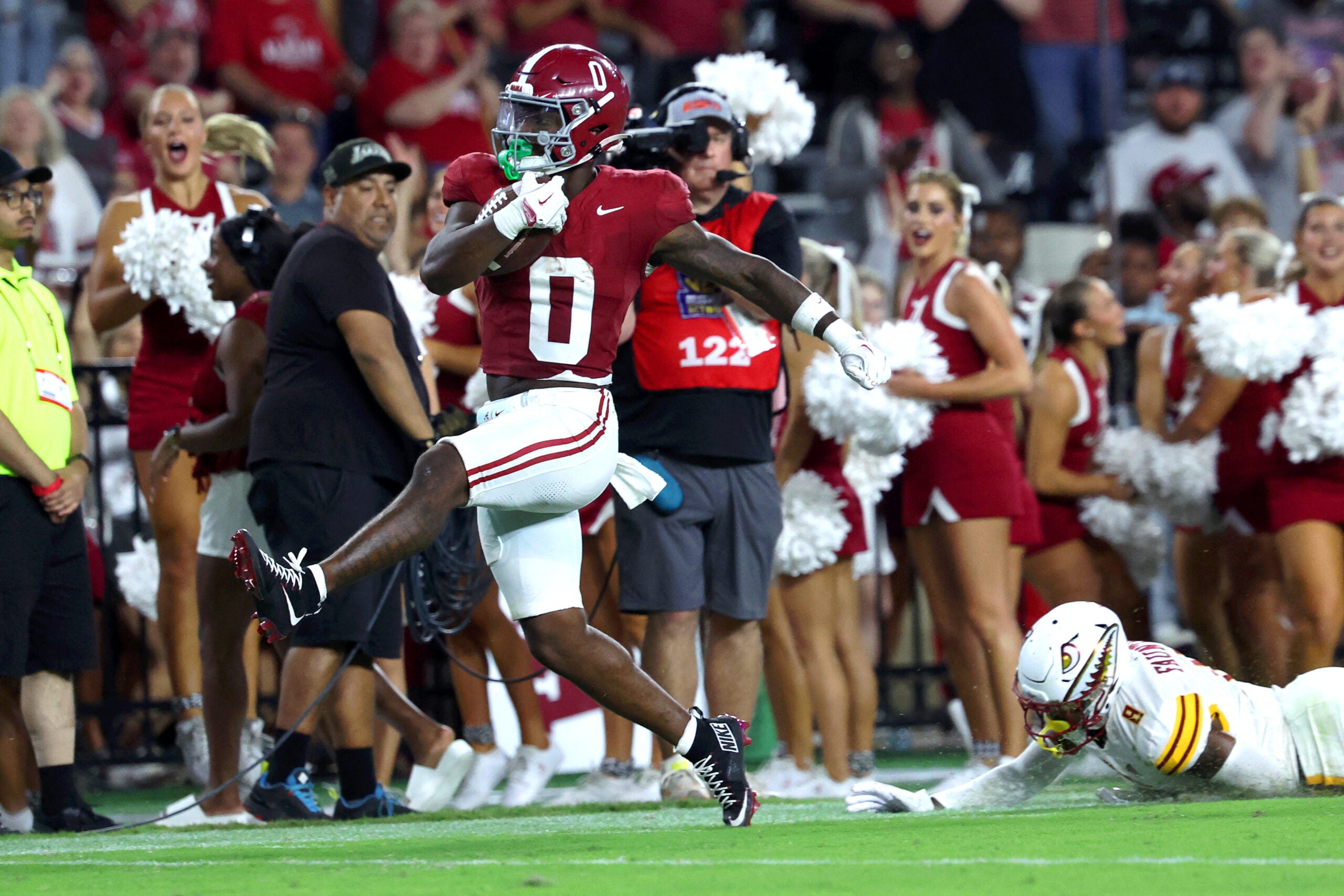 Sep 6, 2025; Tuscaloosa, Alabama, USA; Alabama Crimson Tide running back AK Dear (0) avoids a tackle by Louisiana Monroe Warhawks defensive back Carl Fauntroy (8) as he sprints to the endzone during the second half at Saban Field at Bryant-Denny Stadium.