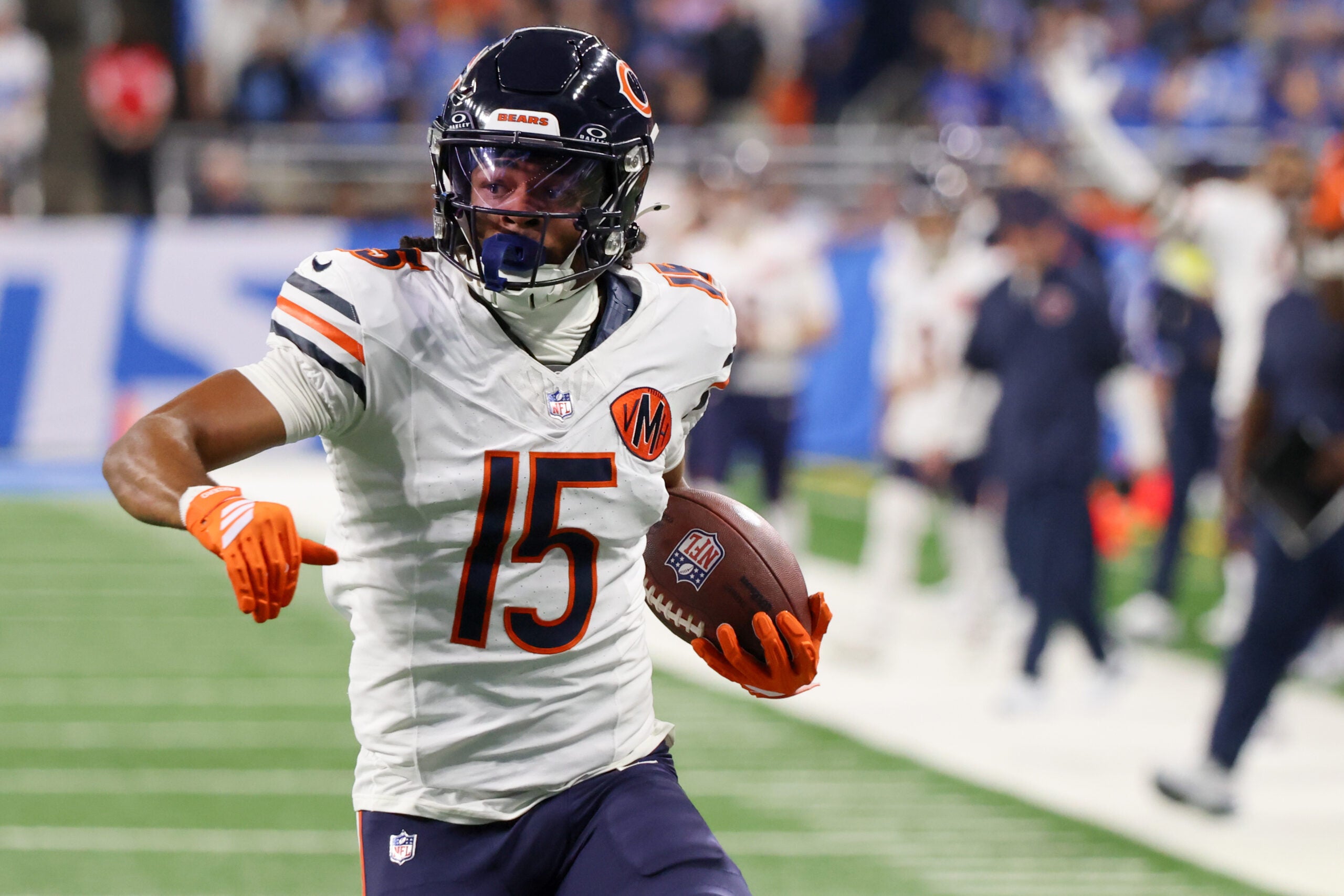 Sep 14, 2025; Detroit, Michigan, USA; Chicago Bears wide receiver Rome Odunze (15) carries the ball for a touchdown against the Detroit Lions during the first quarter at Ford Field.
