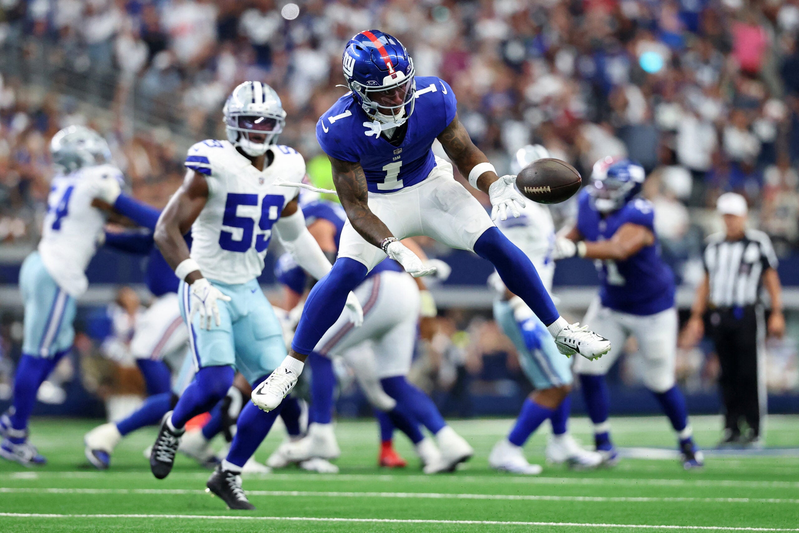 Sep 14, 2025; Arlington, Texas, USA; New York Giants wide receiver Malik Nabers (1) is unable to make a catch against the Dallas Cowboys during the fourth quarter at AT&T Stadium.