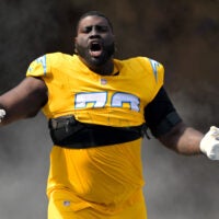 Oct 19, 2025; Inglewood, California, USA; Los Angeles Chargers guard Mekhi Becton (73) runs on to the the field for the game against the Indianapolis Colts at SoFi Stadium.