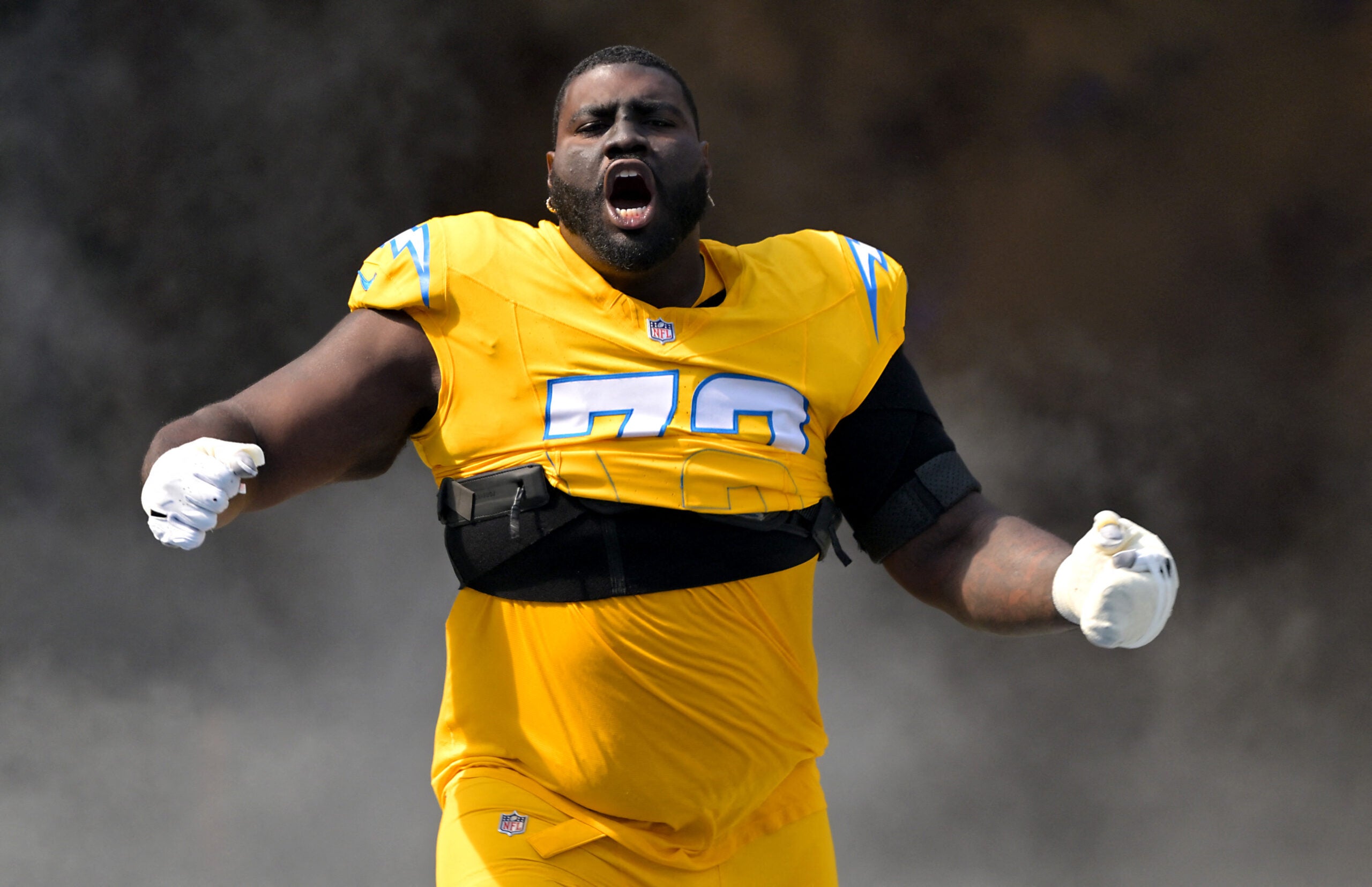 Oct 19, 2025; Inglewood, California, USA; Los Angeles Chargers guard Mekhi Becton (73) runs on to the the field for the game against the Indianapolis Colts at SoFi Stadium.