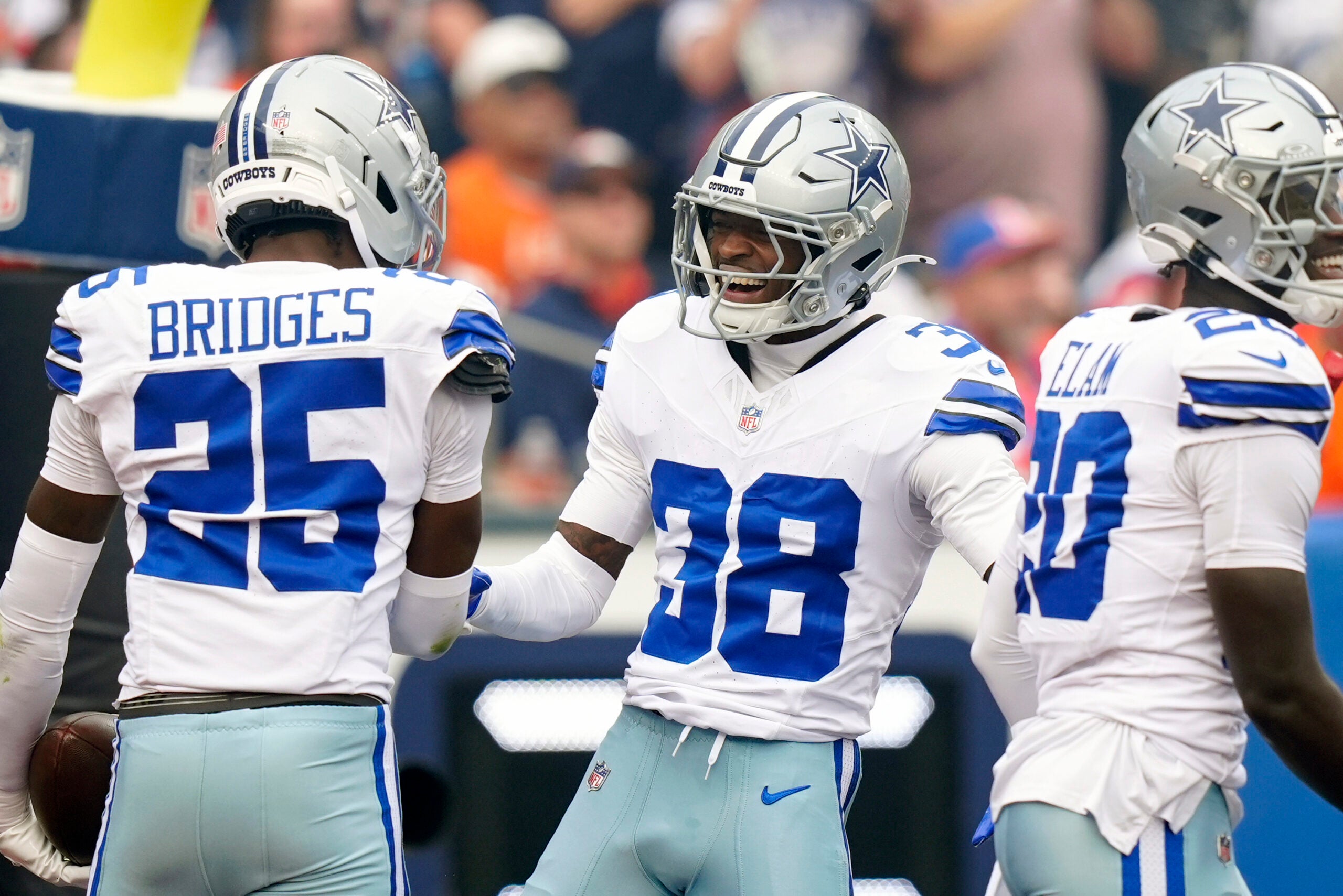Oct 26, 2025; Denver, Colorado, USA; Dallas Cowboys safety Alijah Clark (38) and cornerback Trikweze Bridges (25) react in the first quarter against the Denver Broncos at Empower Field at Mile High.