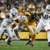 Oct 26, 2025; Pittsburgh, Pennsylvania, USA; Pittsburgh Steelers tight end Jonnu Smith (81) makes a catch against Green Bay Packers linebacker Quay Walker (7) during the second quarter at Acrisure Stadium.