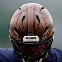 A close-up of a 1923 throwback helmet worn by Green Bay Packers running back Josh Jacobs before the game against the Carolina Panthers on Nov. 2, 2025, at Lambeau Field in Green Bay, Wis.