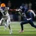 Battle Ground's Maddox Porter (3) holds out his arm against Grace's Campbell Johnson (7) during a TSSAA high school football playoff game between Grace Christian and Battle Ground Academy on Nov. 14, 2025.
