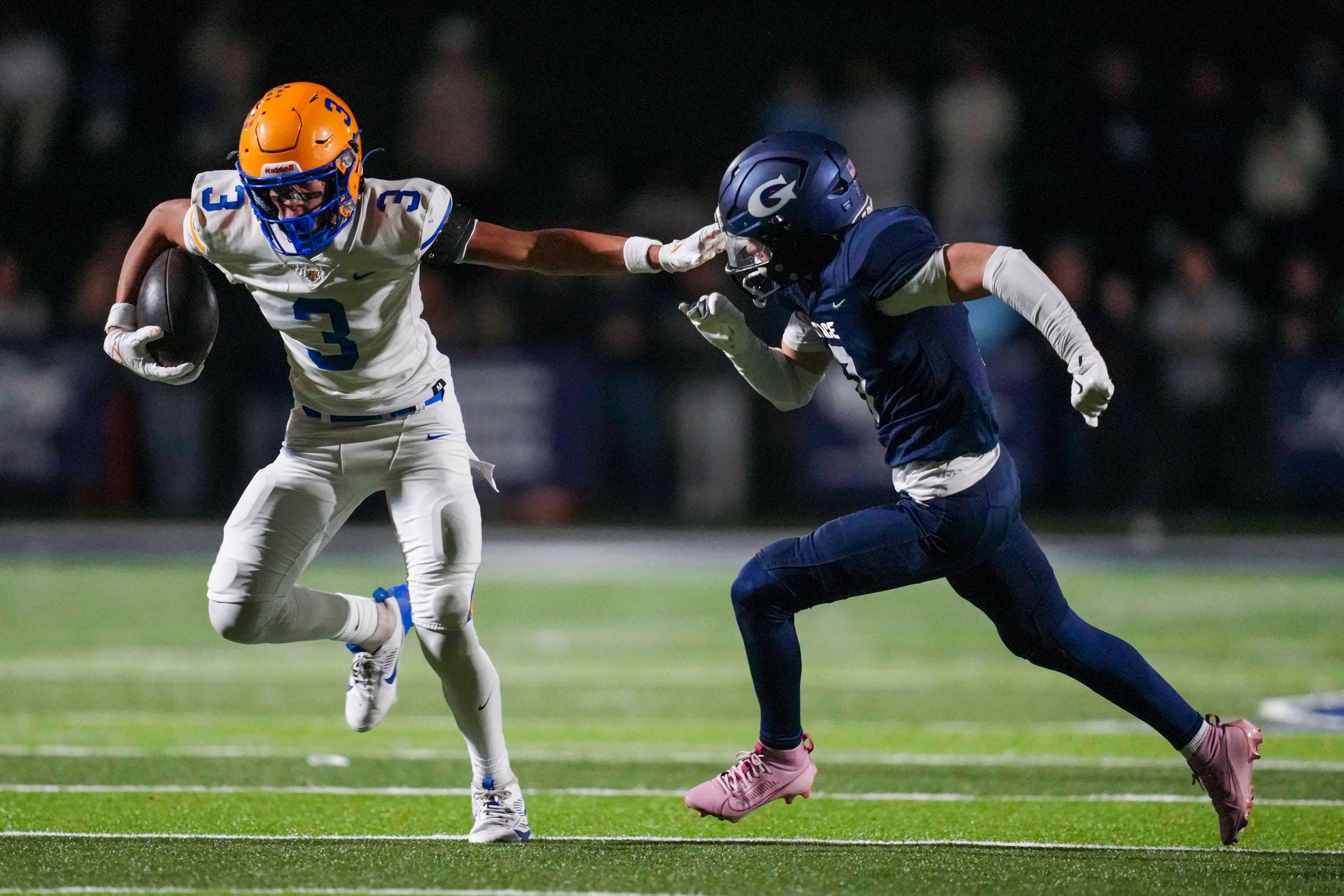 Battle Ground's Maddox Porter (3) holds out his arm against Grace's Campbell Johnson (7) during a TSSAA high school football playoff game between Grace Christian and Battle Ground Academy on Nov. 14, 2025.